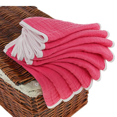 Ten-pack of Synrroe muslin burp cloths laid flat for everyday baby care