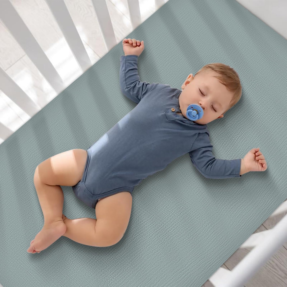 Synrroe muslin crib sheet machine washable for easy, quick changes.