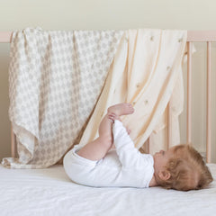 TAB Muslin Swaddle Blanket baby swaddled gently for secure newborn comfort.