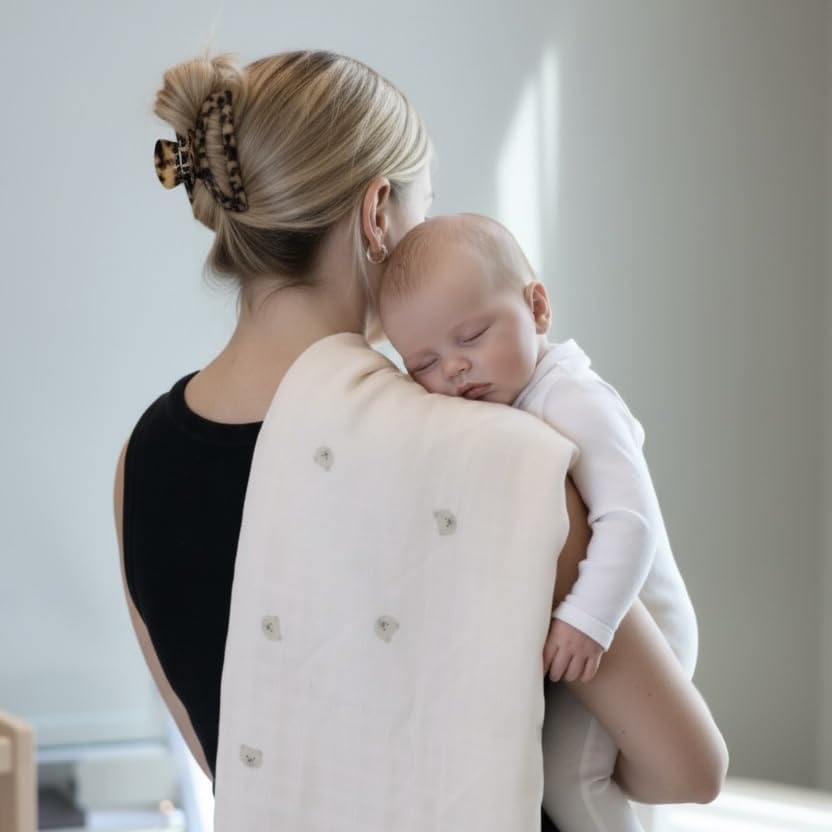TAB Muslin Swaddle Blanket close-up shows bamboo-derived viscose softness on skin.