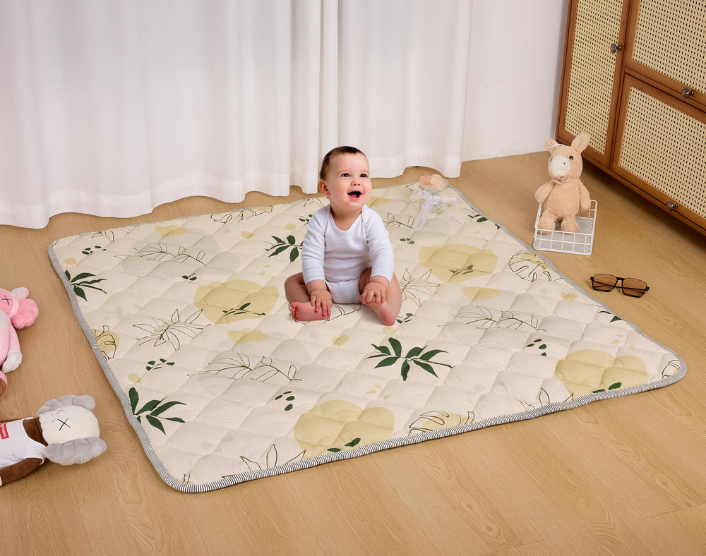 TADO MUSLIN baby play mat with whale print, side view showing secure backing
