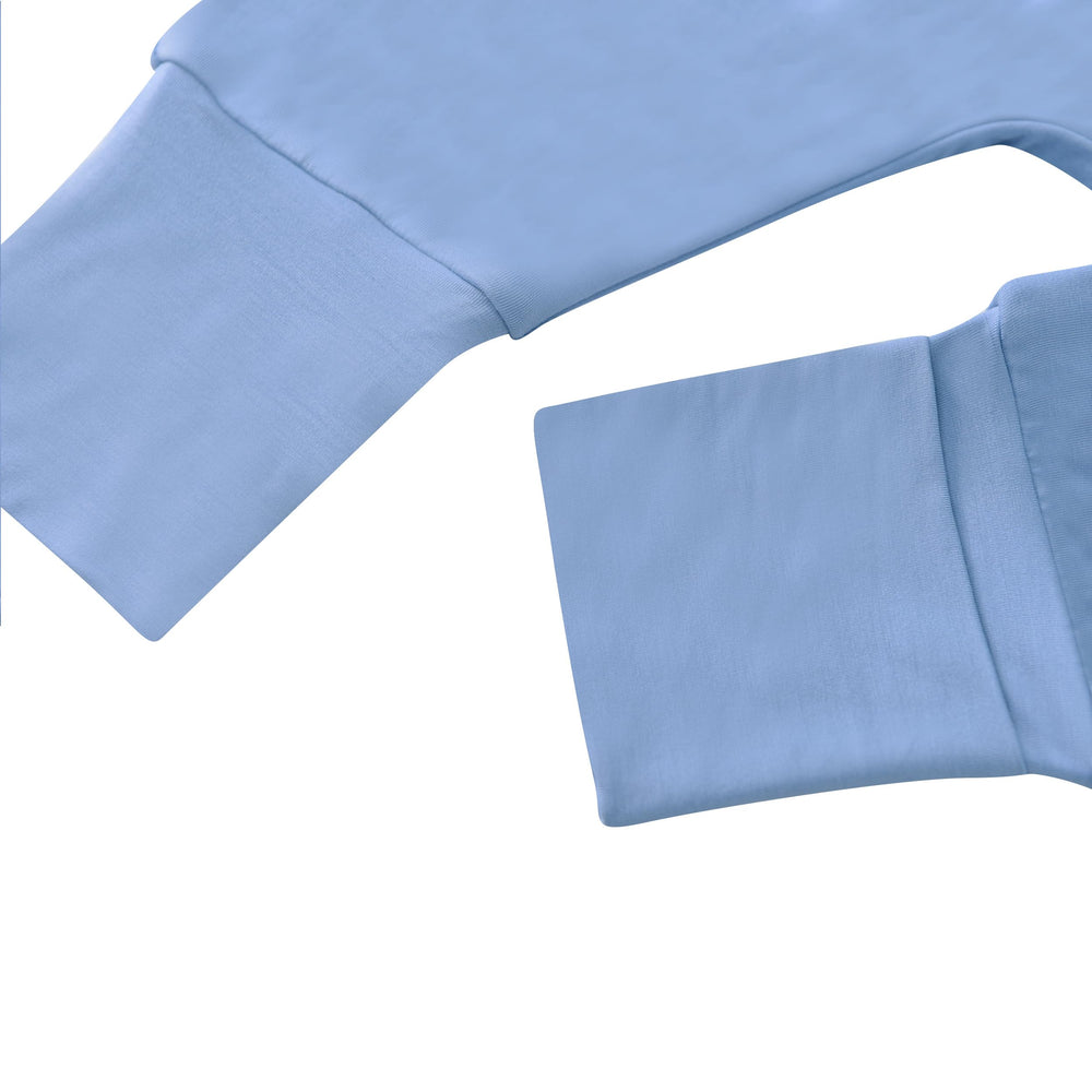 Tado Muslin sleep sack in bed with ambient lighting for cozy sleep