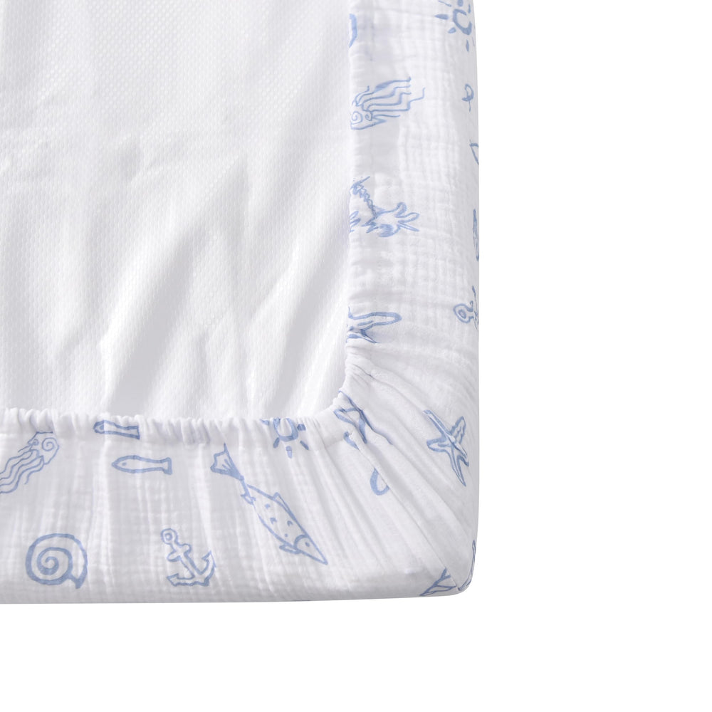 Soft, breathable muslin on TADO MUSLIN changing pad cover in nursery setting