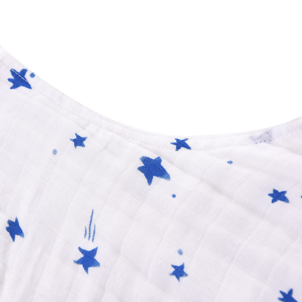 Toddler in crib wearing TADO MUSLIN sleep sack during a warm night