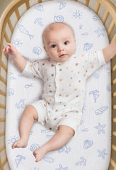 TADO MUSLIN bassinet sheet shows universal fit for oval, rectangle, and hourglass mattresses.