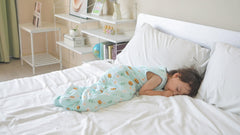 TADO MUSLIN purple design sleep sack highlights gentle stretch for movement-free sleep.