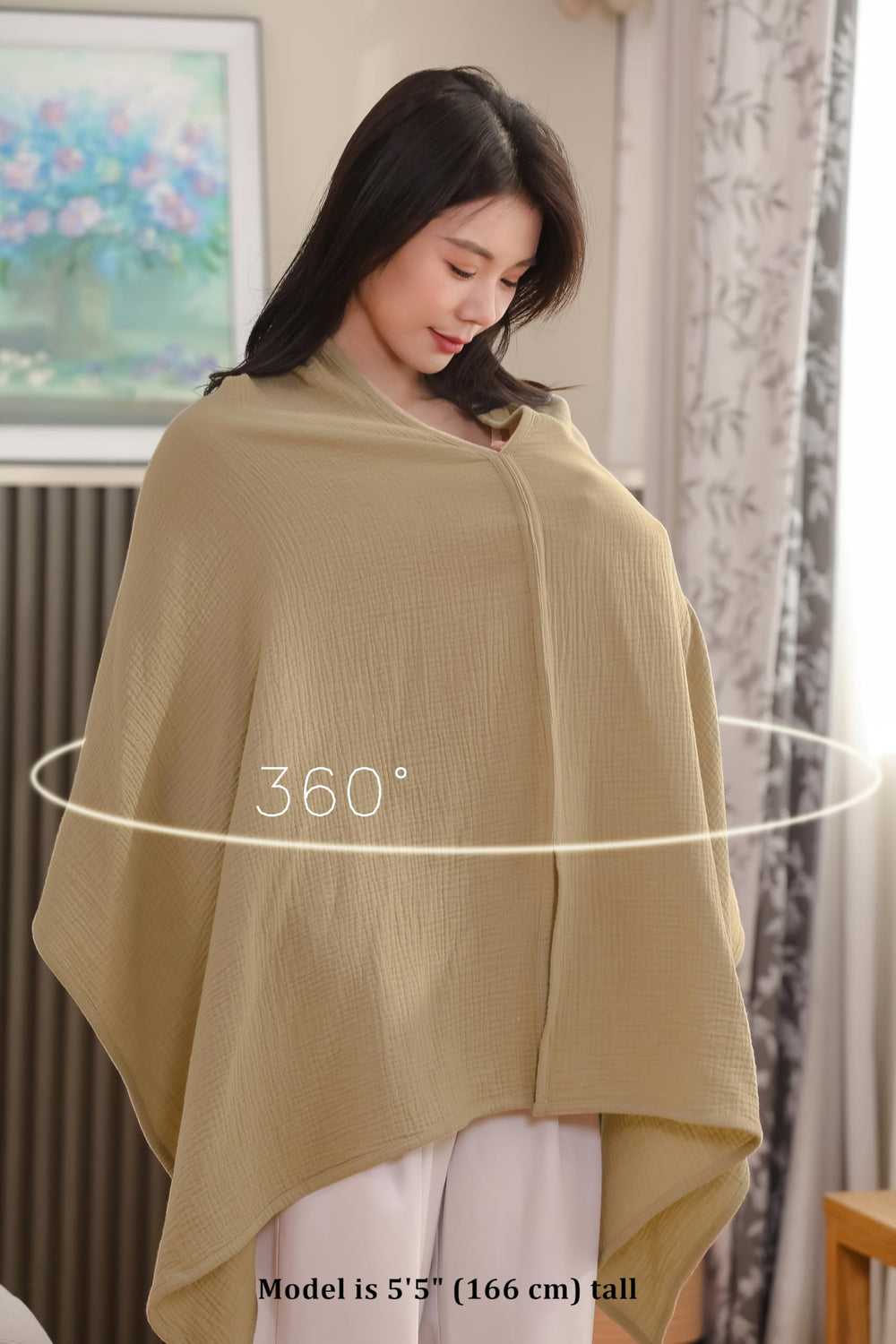Tado Muslin stroller sunshade with peek-a-boo opening for baby.