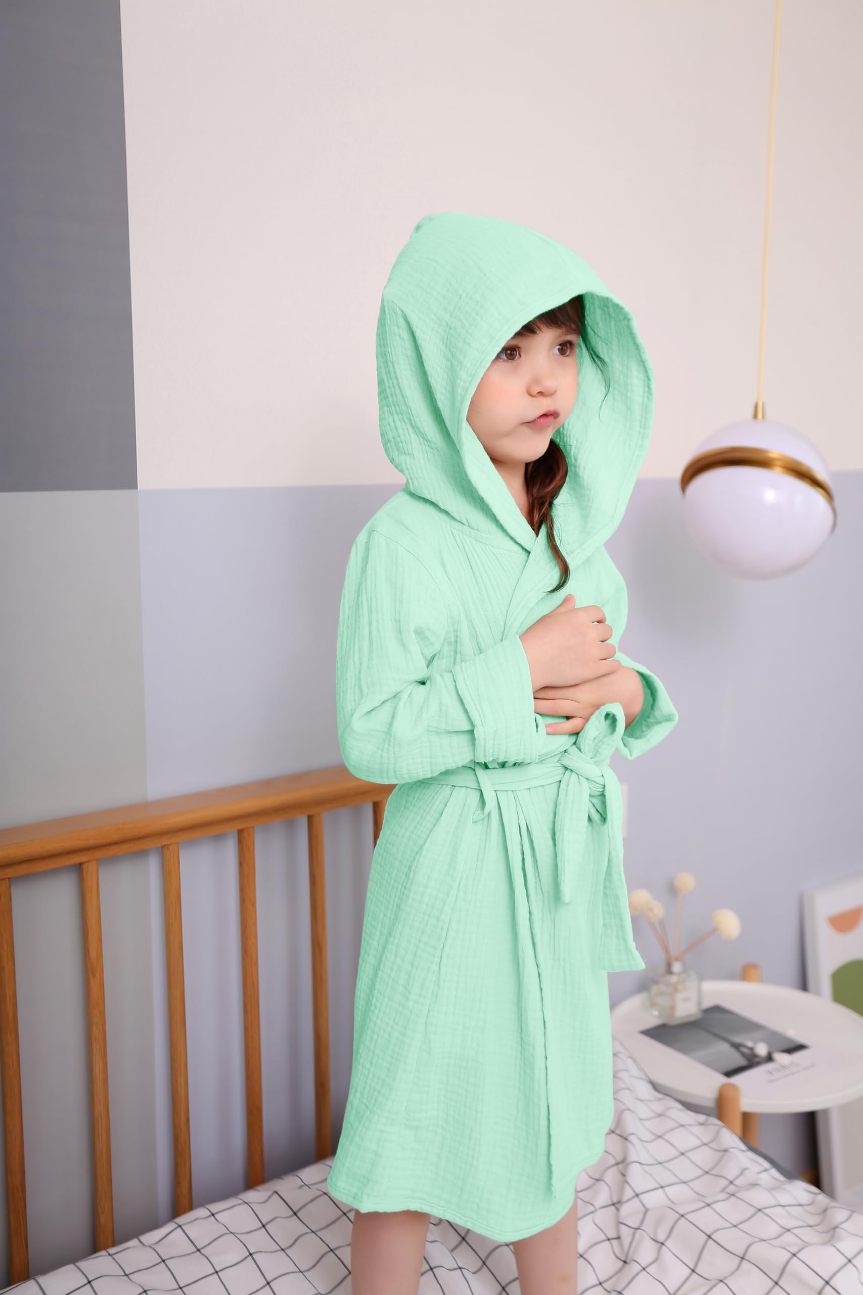 Tado Muslin bathrobe demonstrates absorbent material ideal after baths.