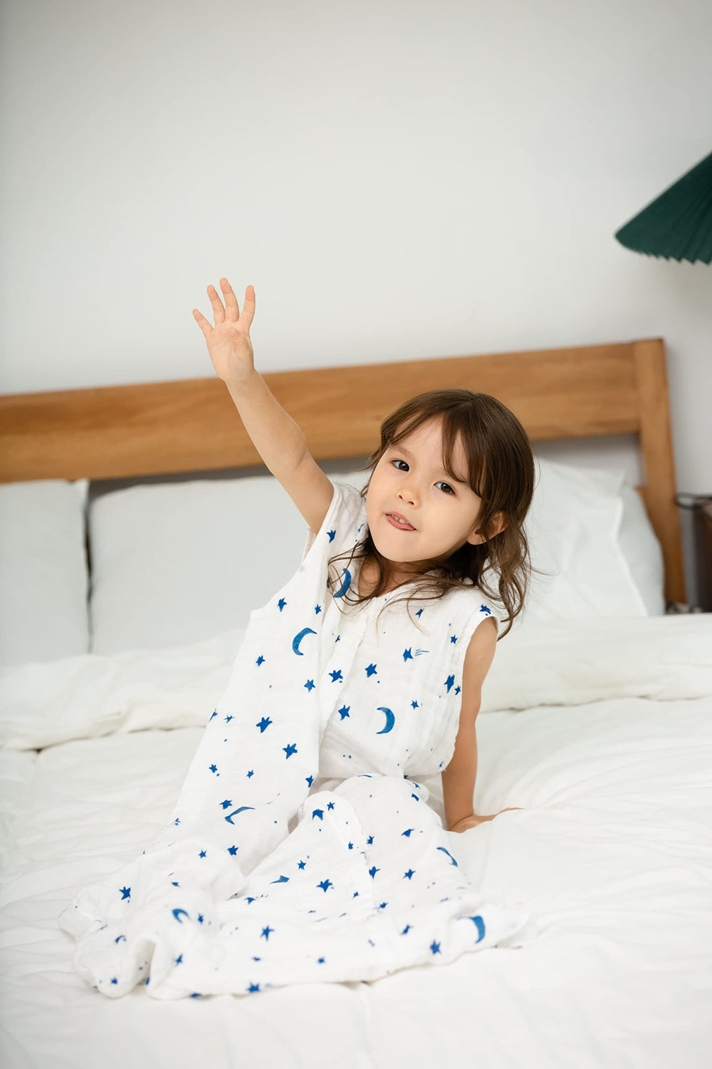 Bottom zipper open on TADO MUSLIN sleep sack for easy night checks