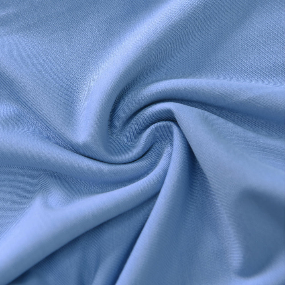 TADO MUSLIN toddler sleeping snugly in blue sleep sack