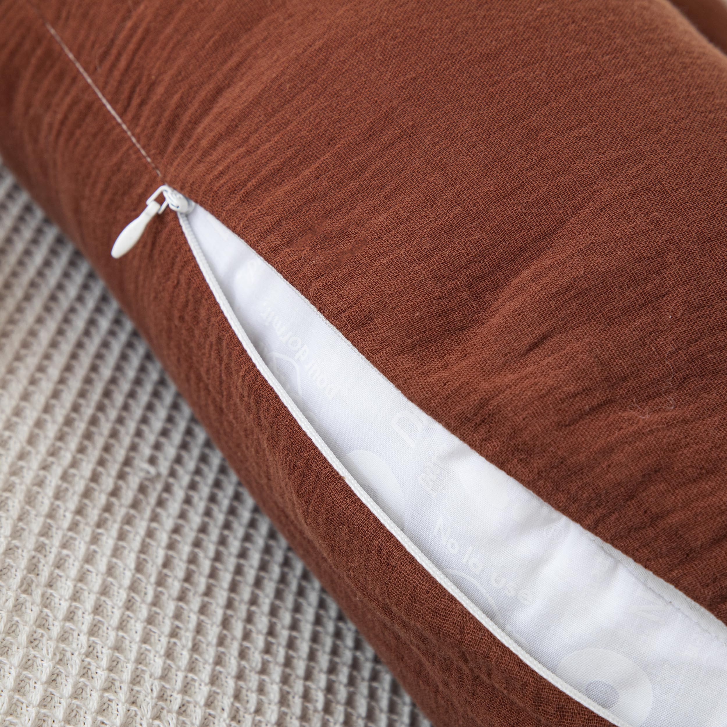 TADO MUSLIN universal-fit U-shaped pillow cover for easy care.