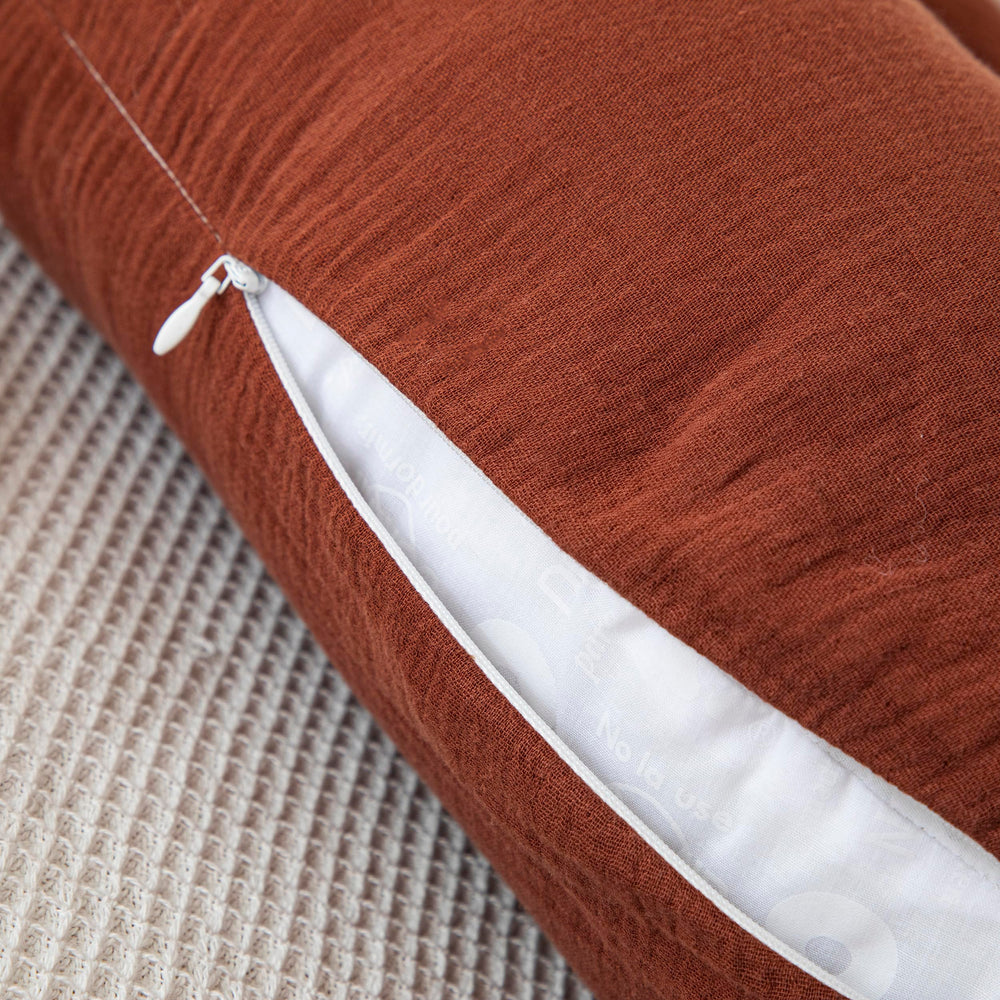 TADO MUSLIN universal-fit U-shaped pillow cover for easy care.