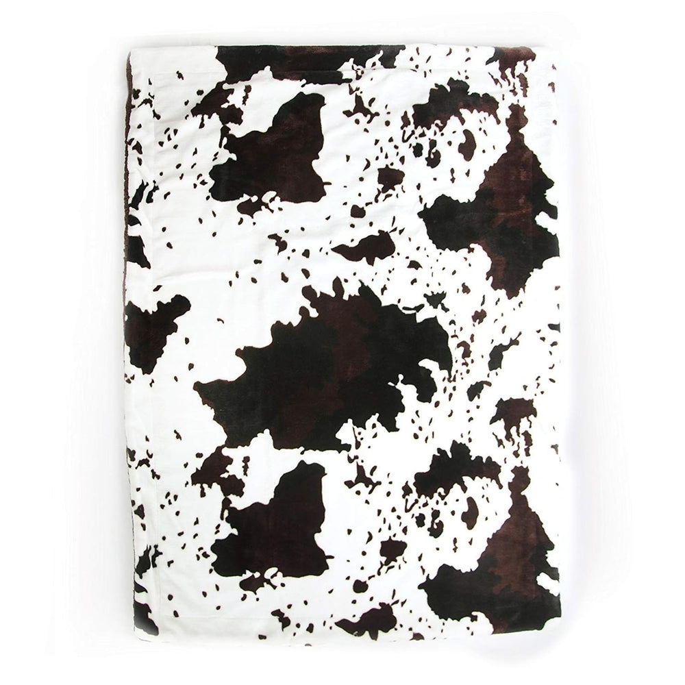 Tadpoles plush sherpa cowhide blanket folded for storage