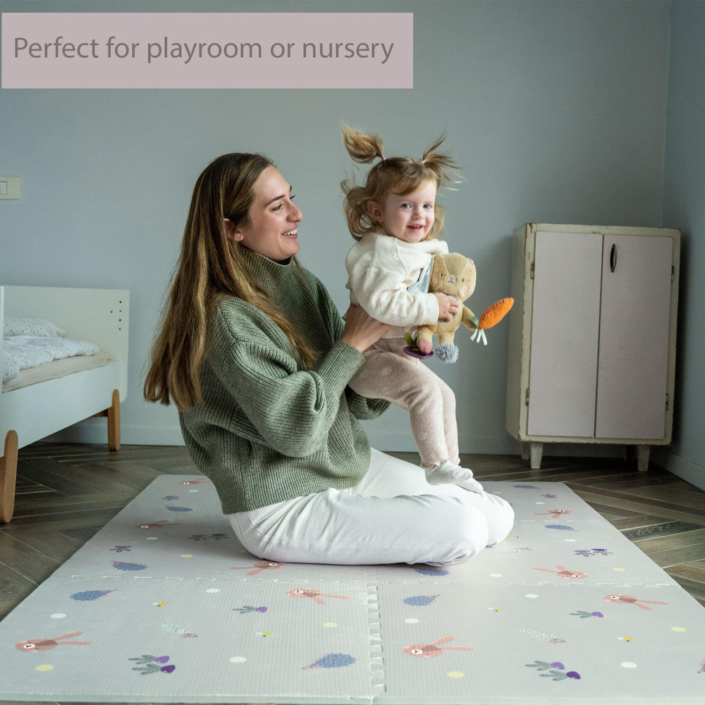 Taf Toys Baby Play Mat shows puzzle pattern with flowers and animals.