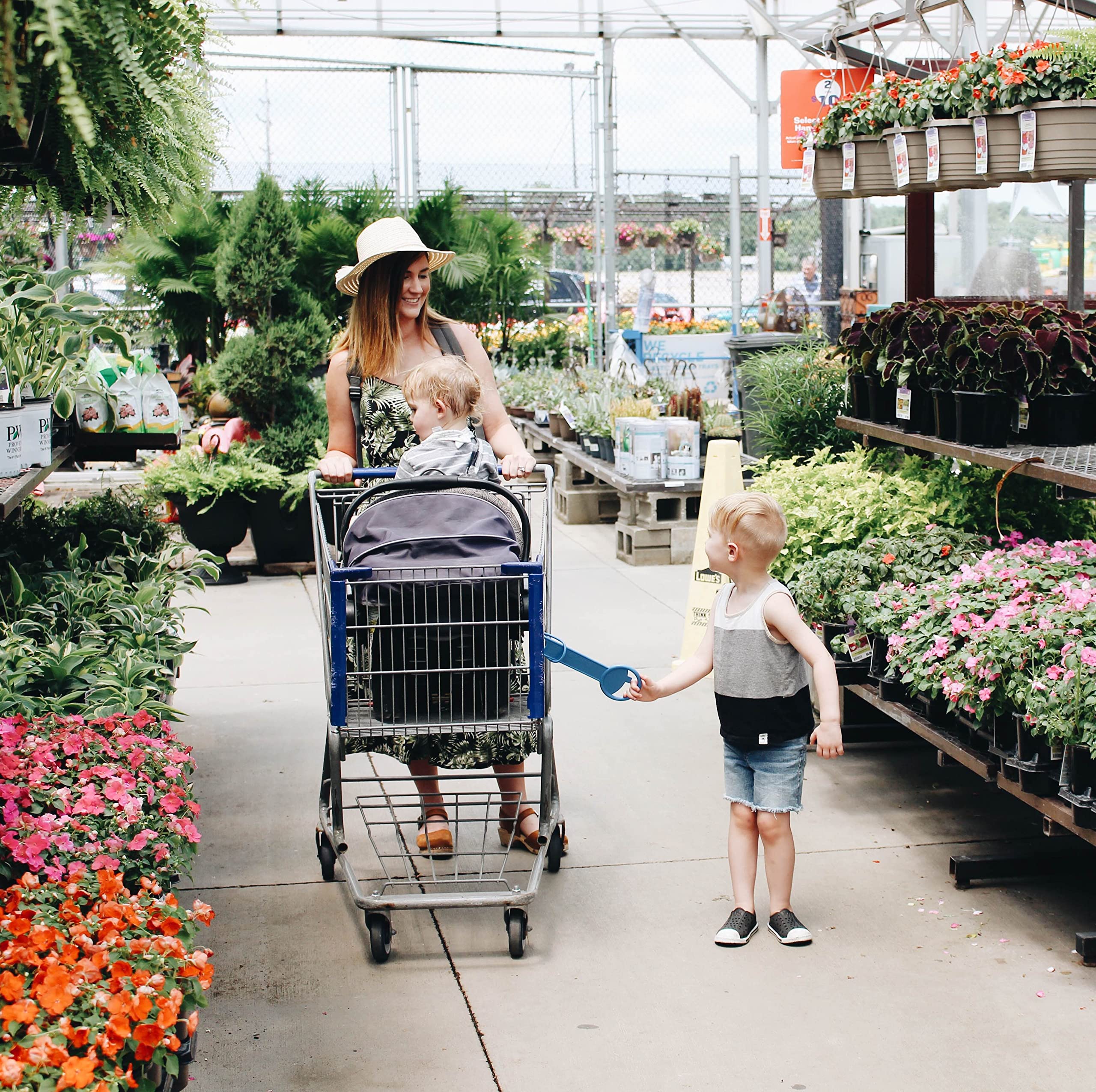 Tagalong clip on a shopping cart secures the toddler in crowded aisles.