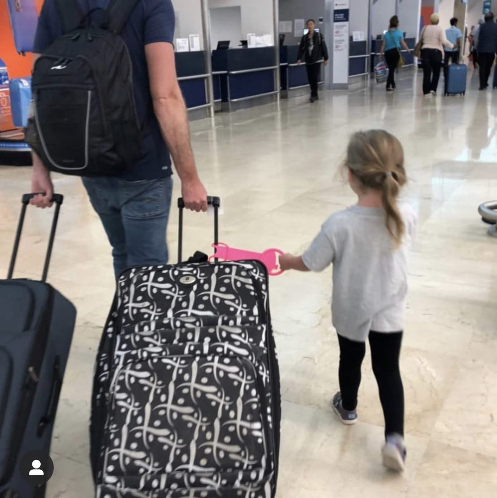 TagalongKids tagalong-luggage-handle-attachment keeps little travelers near while passing through terminals