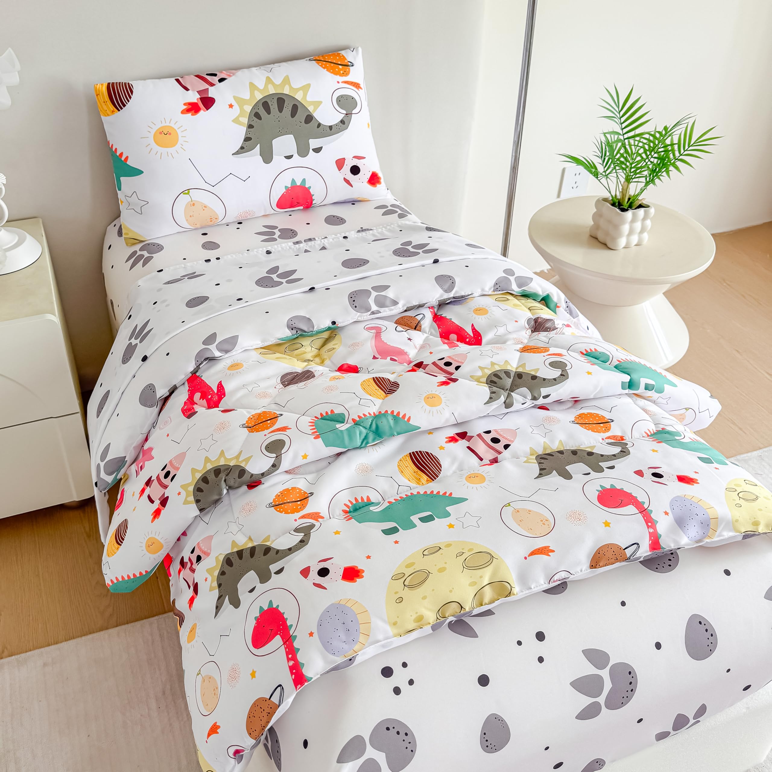 Tailor Shop dinosaur toddler comforter close-up showing ultra-soft fabric for cozy nights