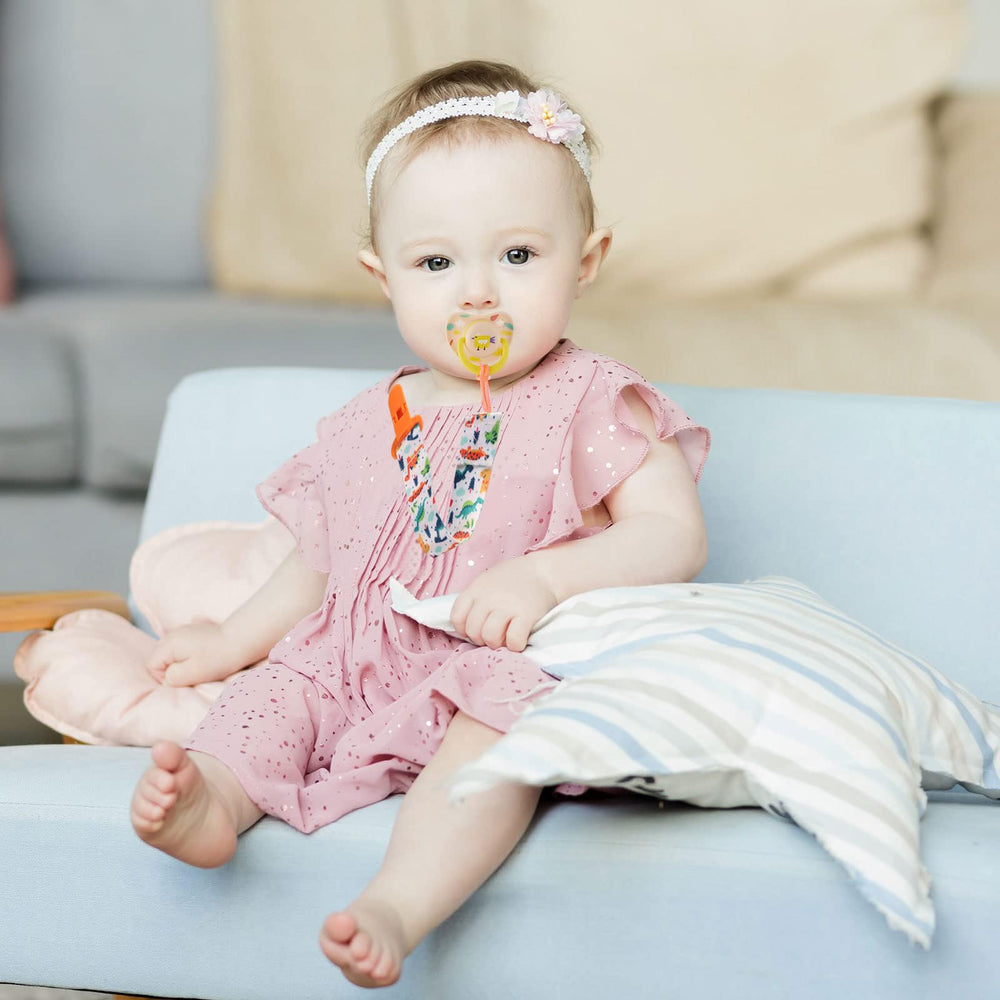 Tamhoo pacifier clips with rainbows add color and grip for outings.