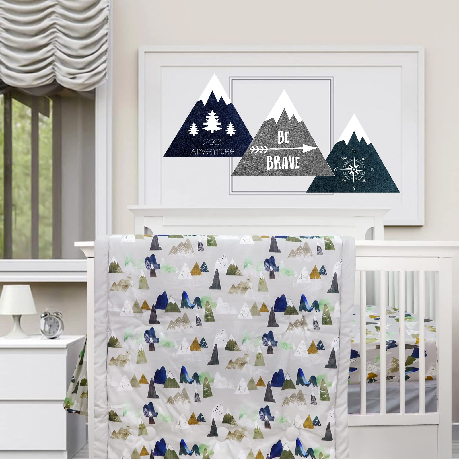 TANOFAR 4-piece crib bedding in grey mountain creates a cozy nursery atmosphere.
