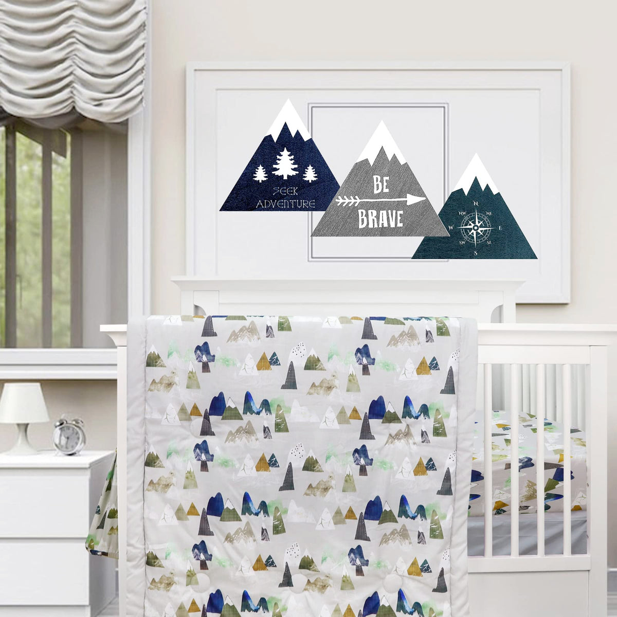 TANOFAR 4-piece crib bedding in grey mountain creates a cozy nursery atmosphere.