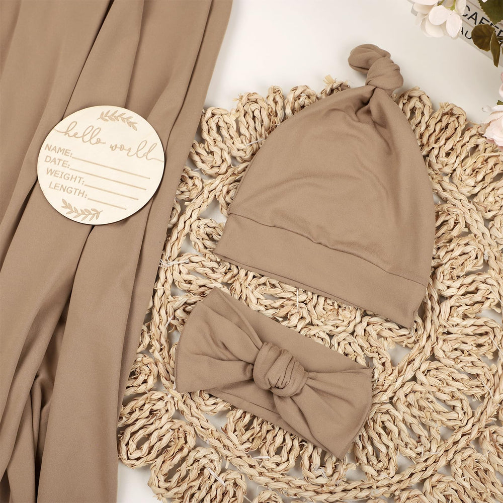 Tanofar brown headband complements baby outfits with gentle stretch.