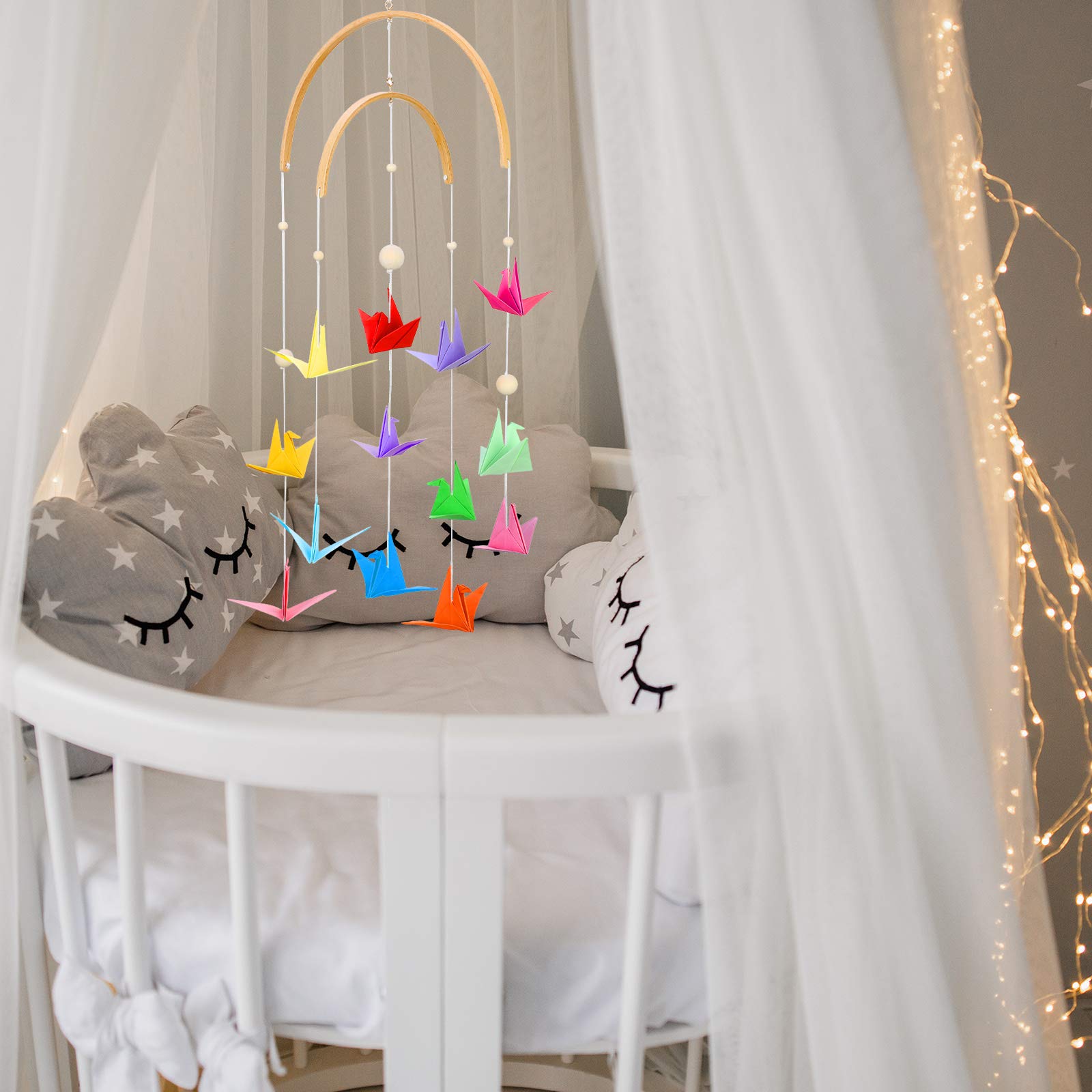 Tatuo semi-circular wind chime adds tranquil breeze tones near cribs.