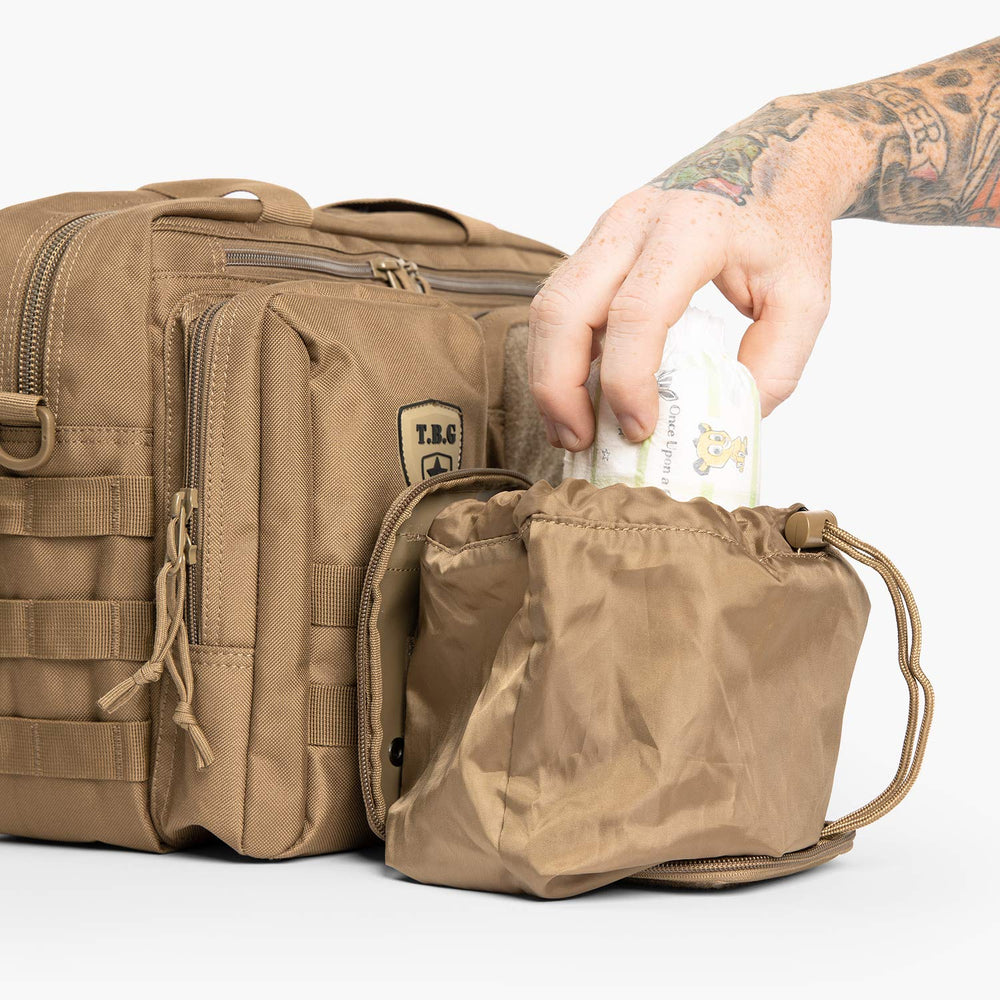 Open full-size sack expands for dirty diaper storage in tight spaces.