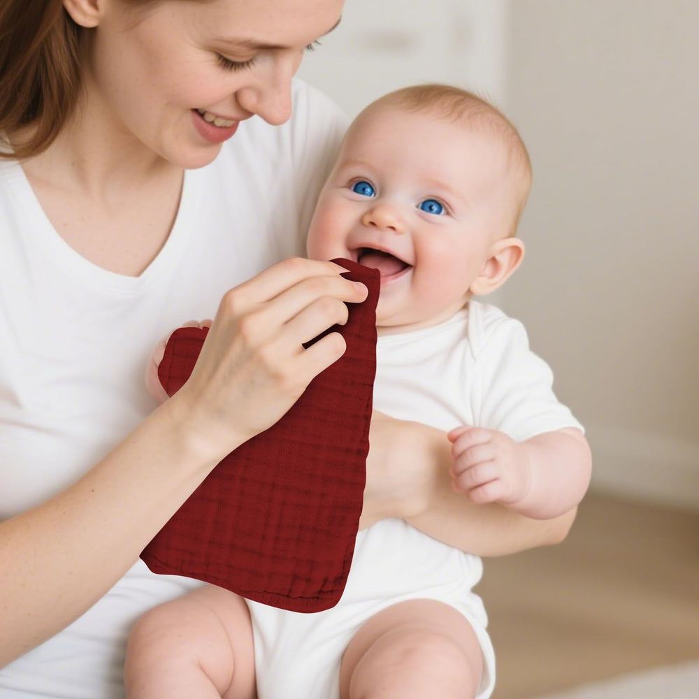 TDHD muslin burp cloths six-pack stack for convenient baby care.