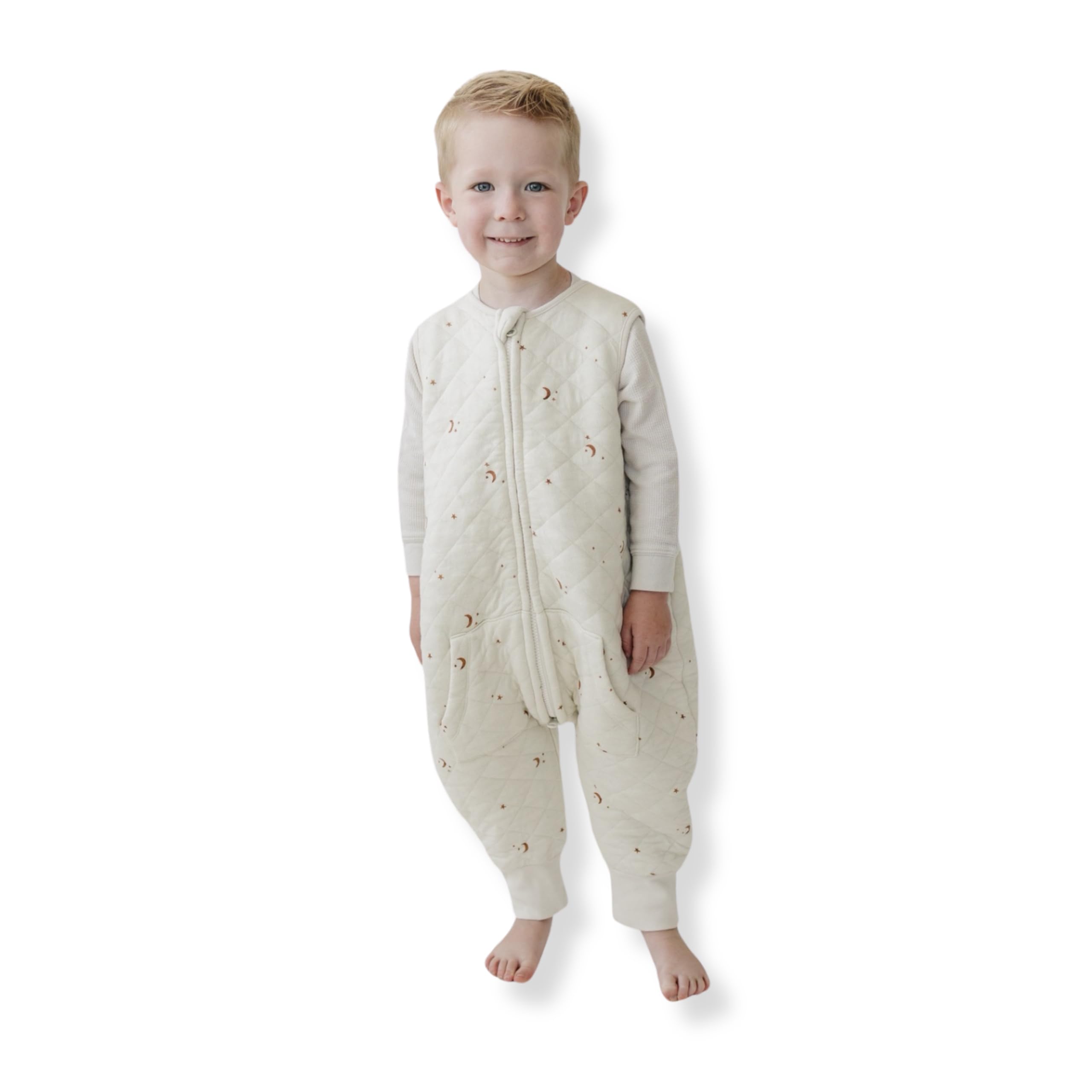 Tealbee Dreamsuit sleep sack with moons and stars for cozy warmth and security.