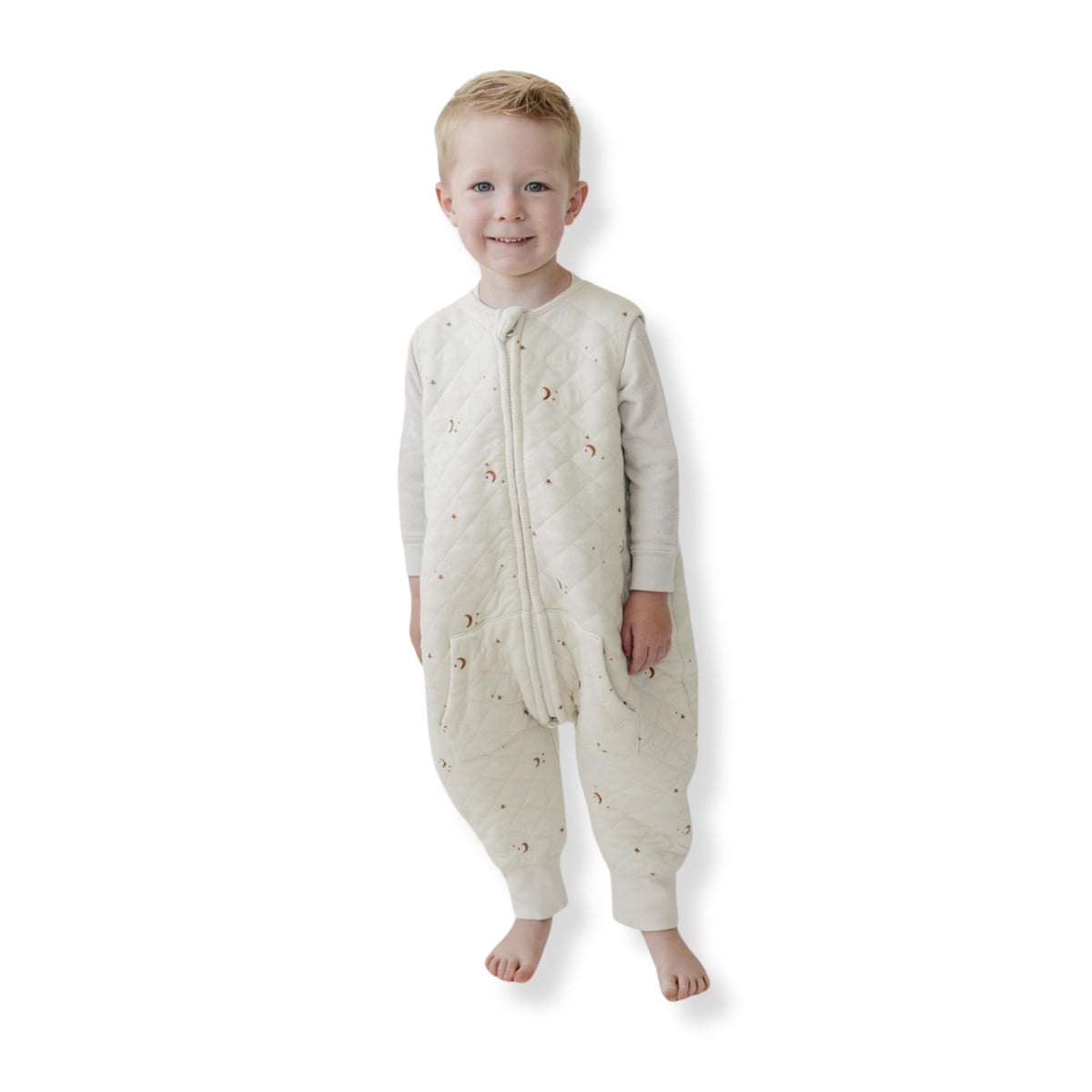 Tealbee Dreamsuit sleep sack with moons and stars for cozy warmth and security.