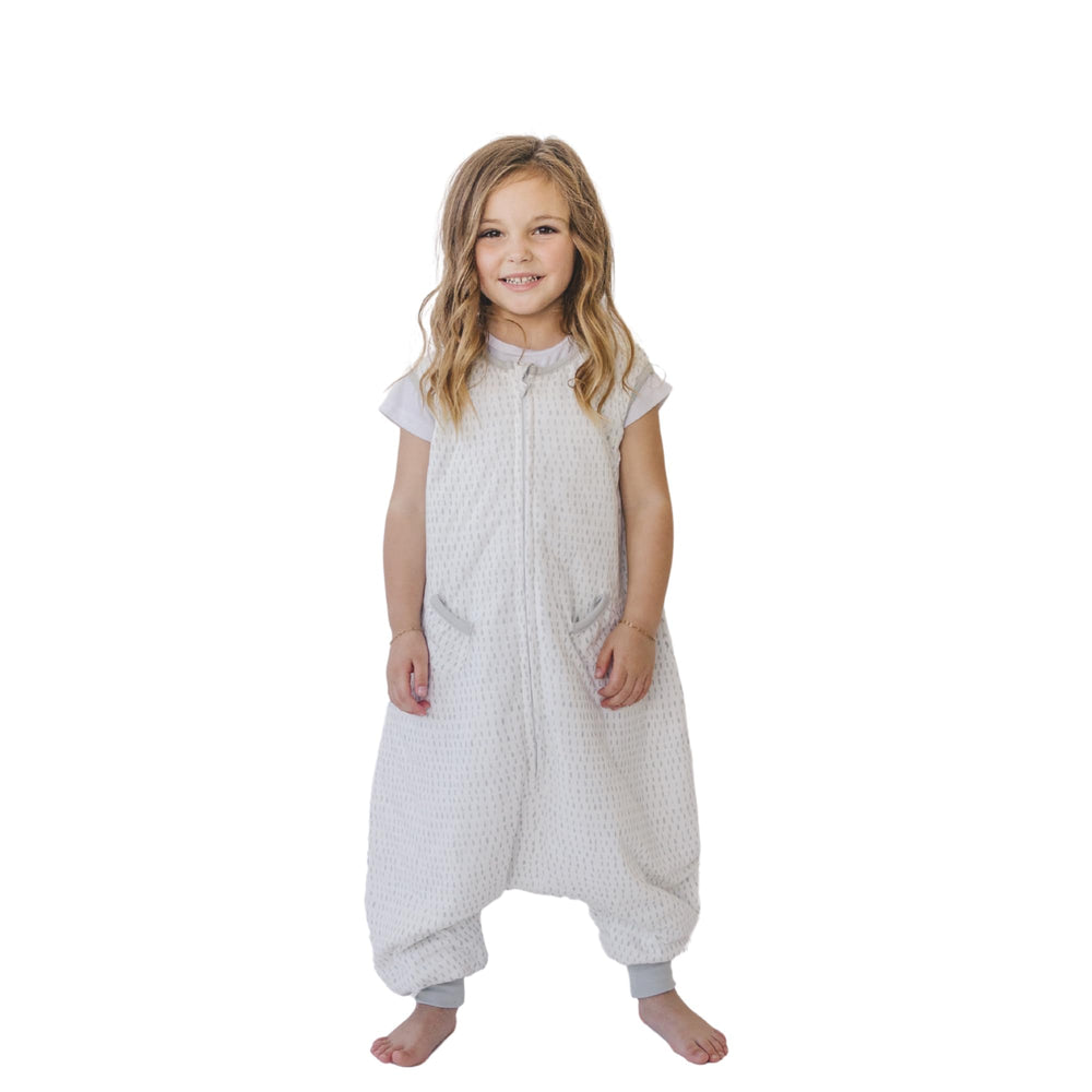 Tealbee Dreamsuit toddler sleep sack with feet on model showing safe movement