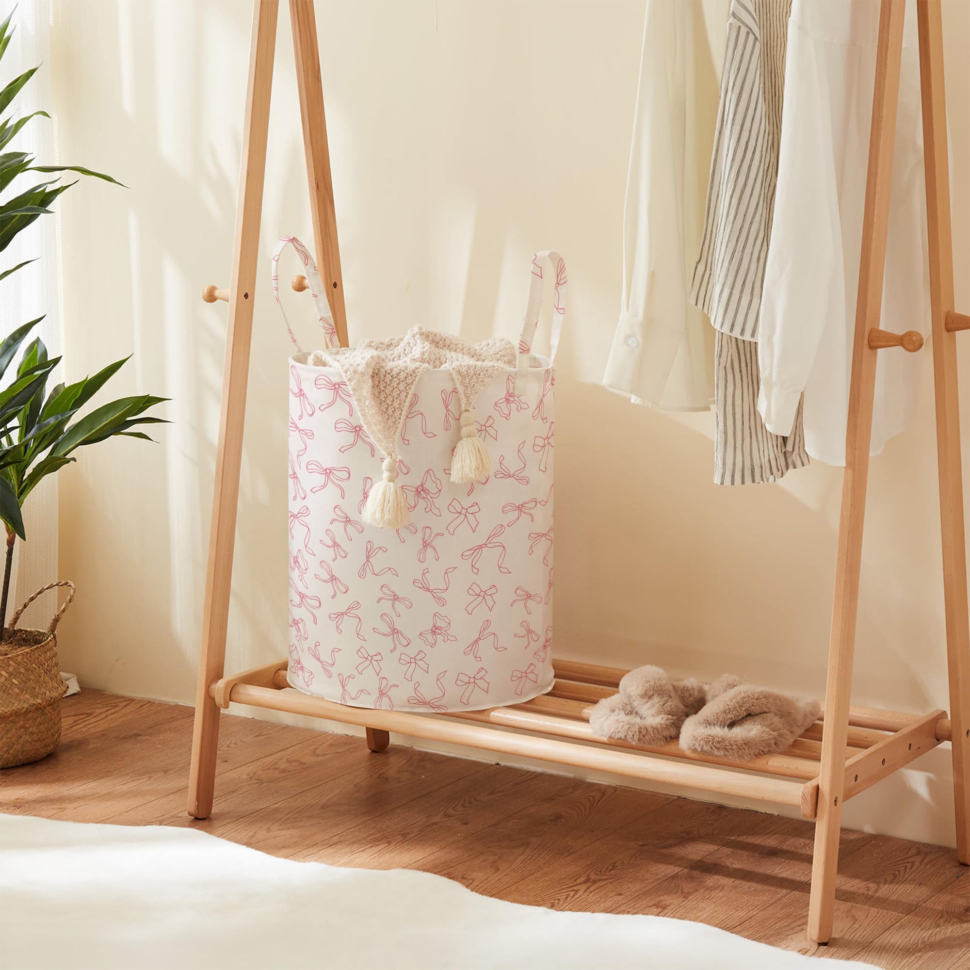 TECHMILLY Bowknot basket in nursery scene helps keep diapers and toys tidy.