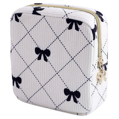 Teircno period bag in corduroy with bow for discreet daily carry and organization.