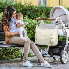 Tenot tote features a pram clip for hands-free strolling with baby.