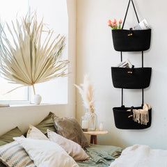 TeoKJ wall-mounted nursery baskets add decorative organization in a bedroom.