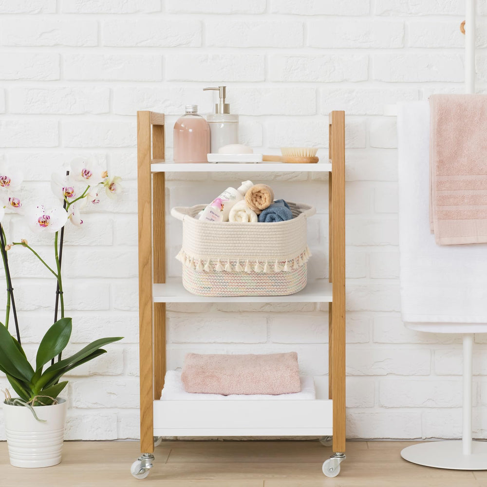 TeoKJ white-pink basket adds soft color while organizing towels or accessories.