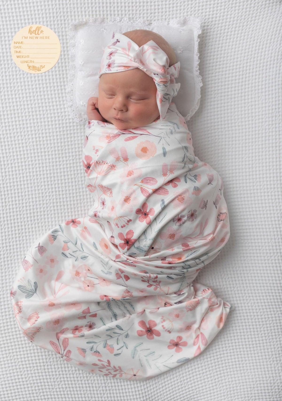 Terriboo newborn floral blanket close-up shows soft stretch fabric for delicate skin.