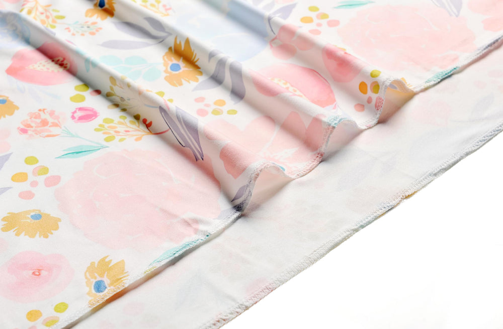 Terriboo newborn floral wrap in orange and pink tones for baby photos.
