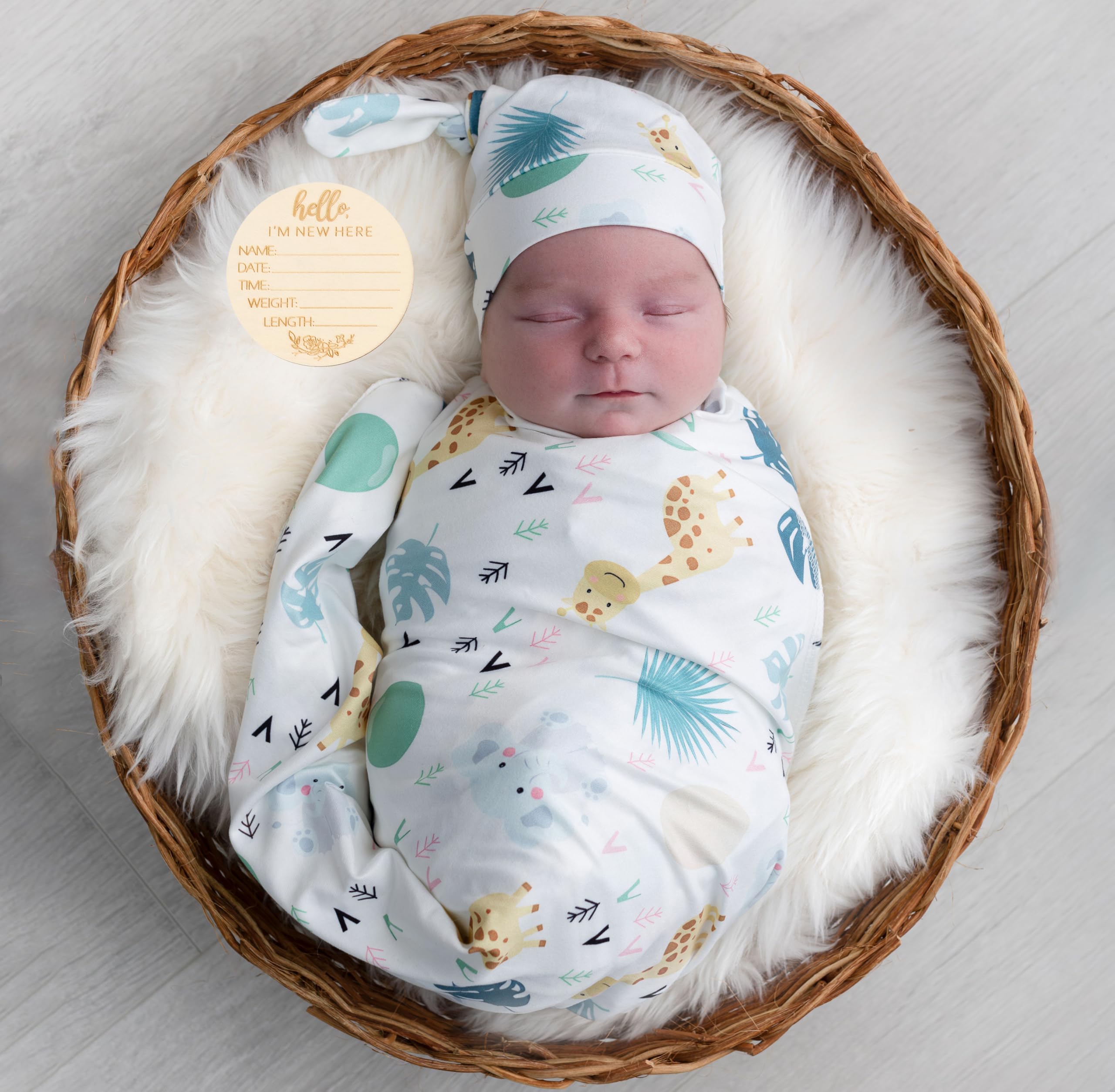 Terriboo newborn swaddle blanket in animal print, soft and breathable for delicate skin.