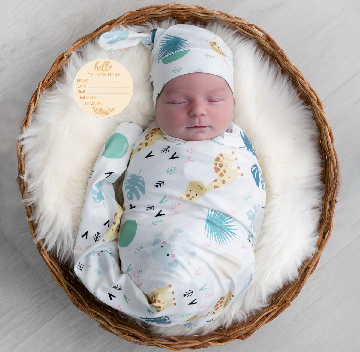 Terriboo newborn swaddle blanket in animal print, soft and breathable for delicate skin.