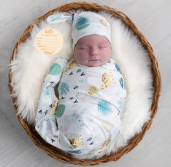 Terriboo newborn swaddle blanket in animal print, soft and breathable for delicate skin.