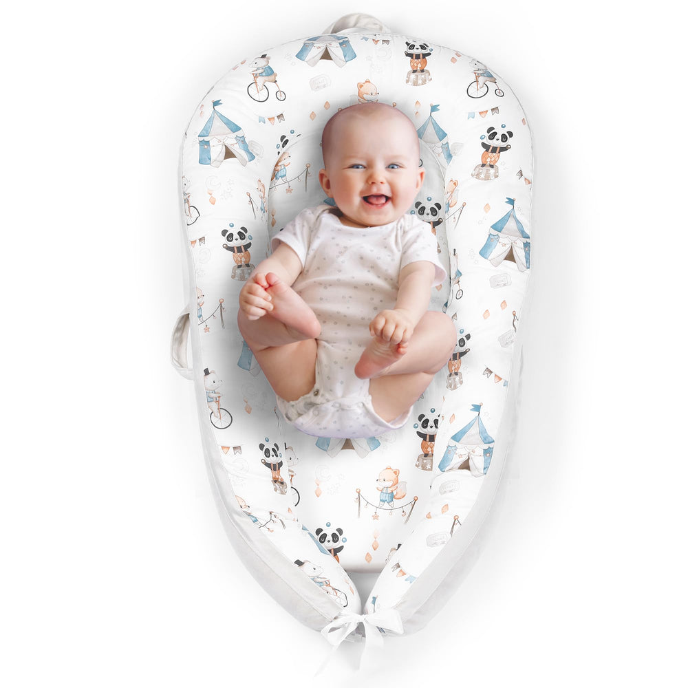 The Baby Room lounger nest with cooling fabric offers soft, breathable newborn comfort