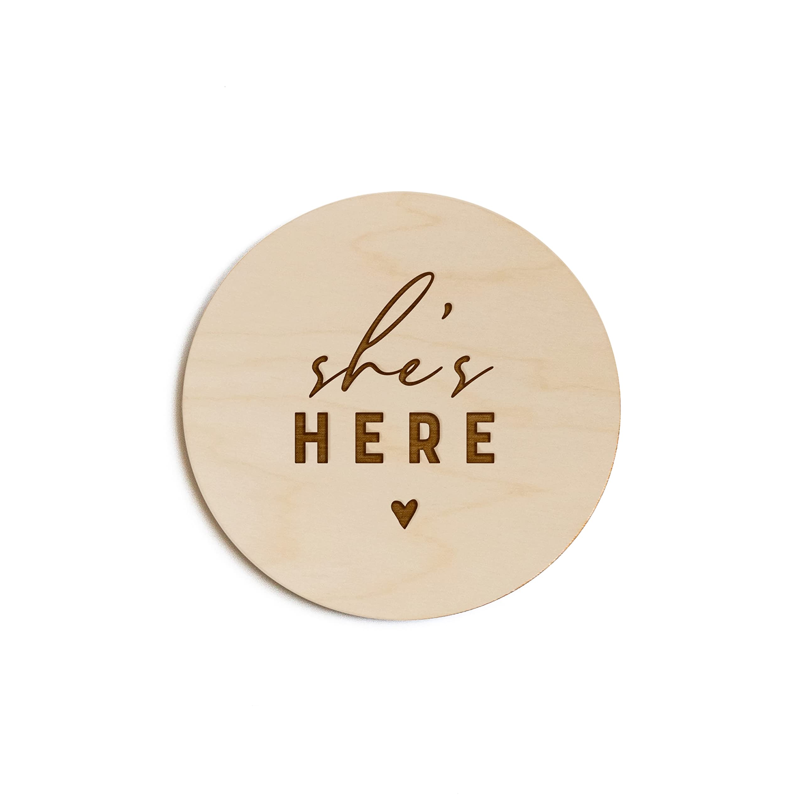 The Cotton & Canvas Co. She's Here wooden disc, ideal for timeless newborn photo props.