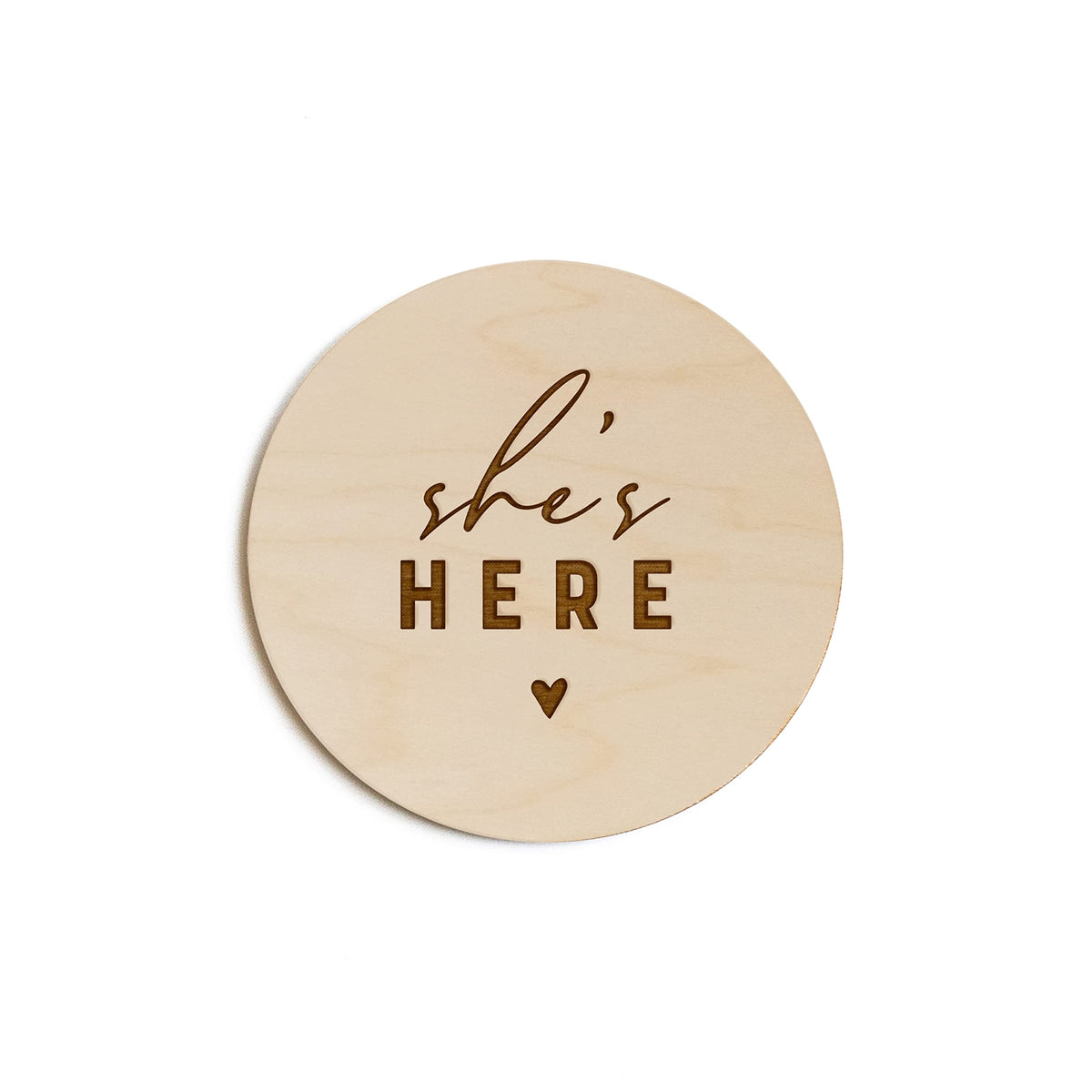 The Cotton & Canvas Co. She's Here wooden disc, ideal for timeless newborn photo props.