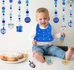 The Dreidel Company Hanukkah bib deep spill pocket captures spills during meals.