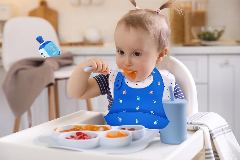 The Dreidel Company Hanukkah bib hand wash only for care.