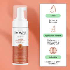 The Honey Pot Amber Sandalwood wash foam close-up showing rich, gentle lather.