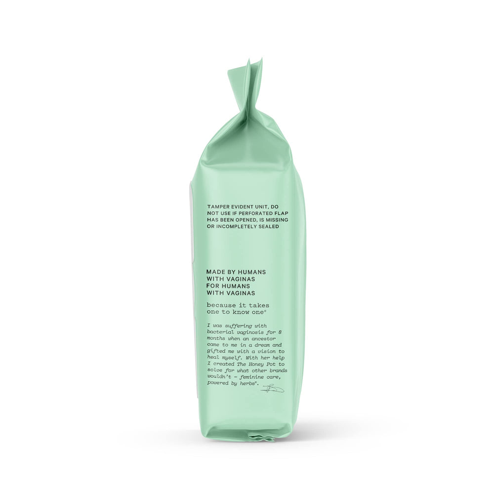 Applying The Honey Pot Anti-Itch Wipes on skin for soothing relief