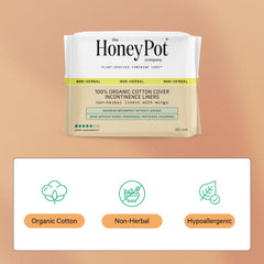 The Honey Pot Non-Herbal Pads with Wings close-up shows the absorbent core for leaks.