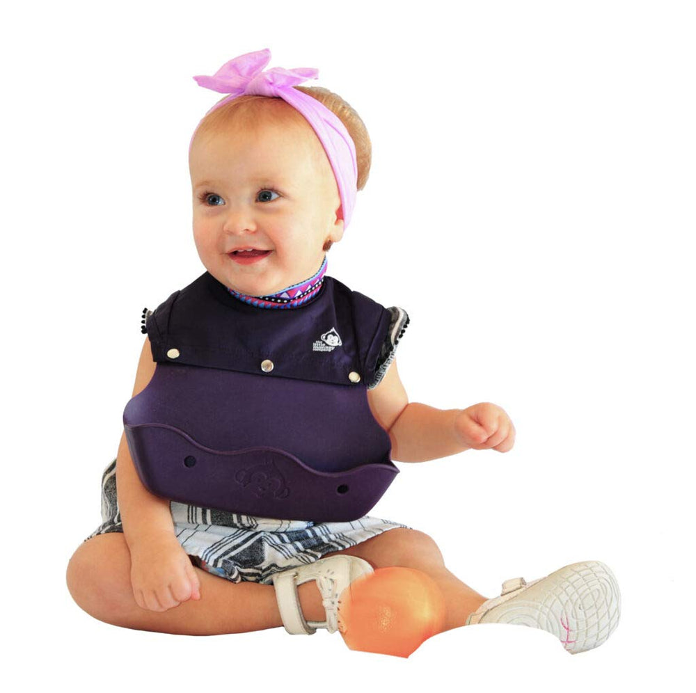 The Little Monkey Company high-neck baby bib provides a snug fit to reduce drips during meals.